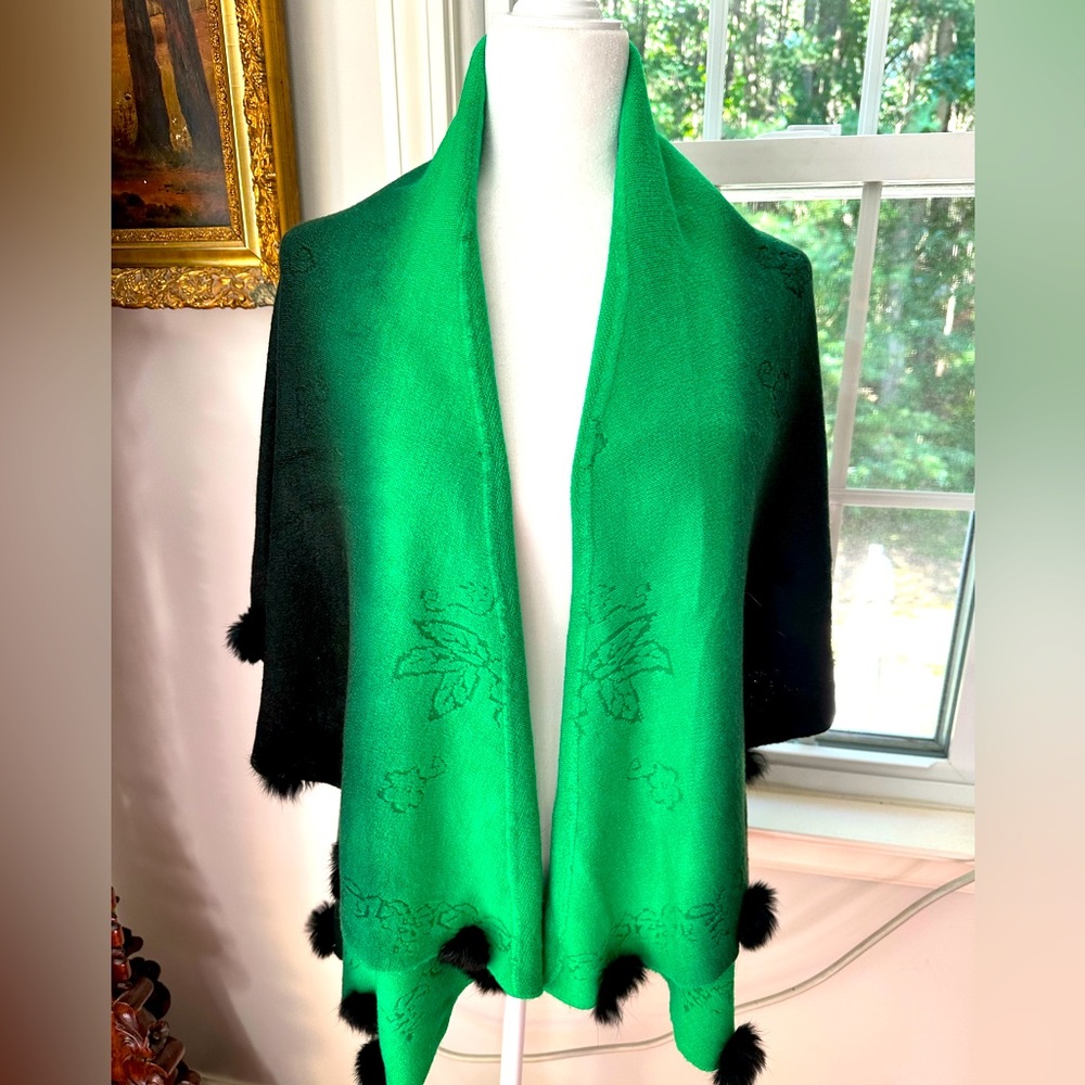 Soft versatile poncho style , vest. Worn different ways soft, w/rabbit pom poms